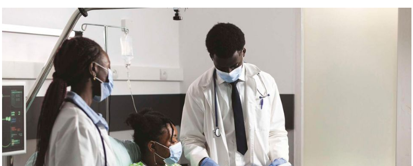 Doctors attending a patient in a Kenyan hospital